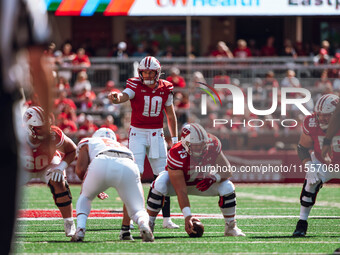 Wisconsin Badgers quarterback Tyler Van Dyke #10 points out the South Dakota Coyotes defense at Camp Randall Stadium in Madison, Wisconsin,...