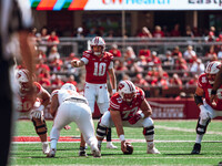 Wisconsin Badgers quarterback Tyler Van Dyke #10 points out the South Dakota Coyotes defense at Camp Randall Stadium in Madison, Wisconsin,...