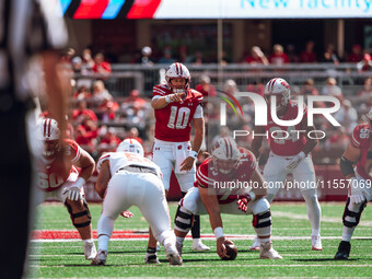 Wisconsin Badgers quarterback Tyler Van Dyke #10 points out the South Dakota Coyotes defense at Camp Randall Stadium in Madison, Wisconsin,...