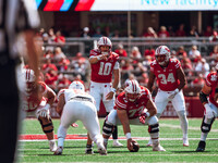 Wisconsin Badgers quarterback Tyler Van Dyke #10 points out the South Dakota Coyotes defense at Camp Randall Stadium in Madison, Wisconsin,...