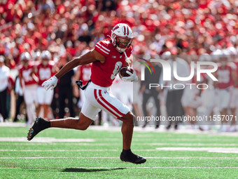 Wisconsin Badgers wide receiver Bryson Green #9 outruns the defense of the South Dakota Coyotes at Camp Randall Stadium in Madison, Wisconsi...