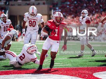 Wisconsin Badgers running back Chez Mellusi #1 scores a touchdown against the South Dakota Coyotes at Camp Randall Stadium in Madison, Wisco...