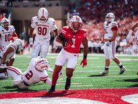 Wisconsin Badgers running back Chez Mellusi #1 scores a touchdown against the South Dakota Coyotes at Camp Randall Stadium in Madison, Wisco...