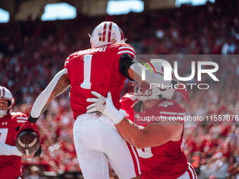 Wisconsin Badgers running back Chez Mellusi #1 celebrates a touchdown against the South Dakota Coyotes at Camp Randall Stadium in Madison, W...