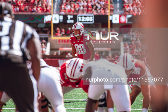 Wisconsin Badgers kicker Nathanial Vakos #90 lines up an extra point at Camp Randall Stadium in Madison, Wisconsin, on September 7, 2024. 