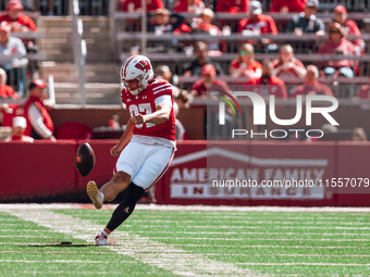 Wisconsin Badgers kicker Gavin Lahm #97 kicks off against the South Dakota Coyotes at Camp Randall Stadium in Madison, Wisconsin, on Septemb...