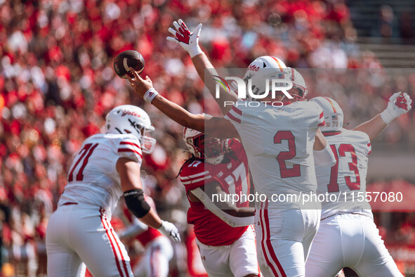 South Dakota quarterback Aidan Bouman #2 attempts to pass at Camp Randall Stadium in Madison, Wisconsin, on September 7, 2024. 