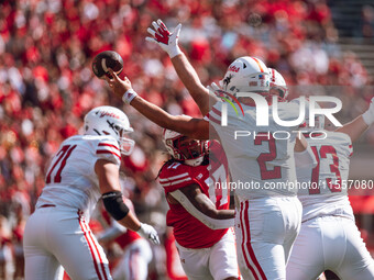 South Dakota quarterback Aidan Bouman #2 attempts to pass at Camp Randall Stadium in Madison, Wisconsin, on September 7, 2024. (