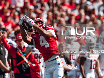 Wisconsin Badgers wide receiver C.J. Williams #4 catches a pass against the South Dakota Coyotes at Camp Randall Stadium in Madison, Wiscons...