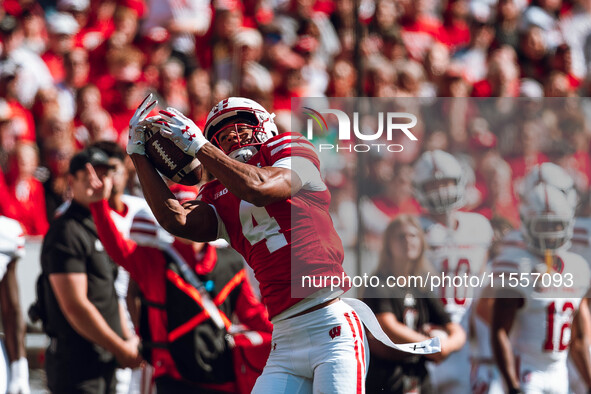 Wisconsin Badgers wide receiver C.J. Williams #4 catches a pass against the South Dakota Coyotes at Camp Randall Stadium in Madison, Wiscons...