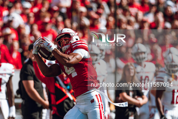 Wisconsin Badgers wide receiver C.J. Williams #4 catches a pass against the South Dakota Coyotes at Camp Randall Stadium in Madison, Wiscons...