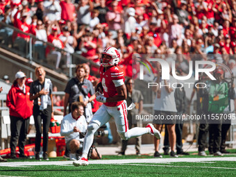 Wisconsin Badgers wide receiver C.J. Williams #4 scores a touchdown against the South Dakota Coyotes at Camp Randall Stadium in Madison, Wis...