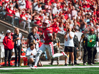 Wisconsin Badgers wide receiver C.J. Williams #4 scores a touchdown against the South Dakota Coyotes at Camp Randall Stadium in Madison, Wis...