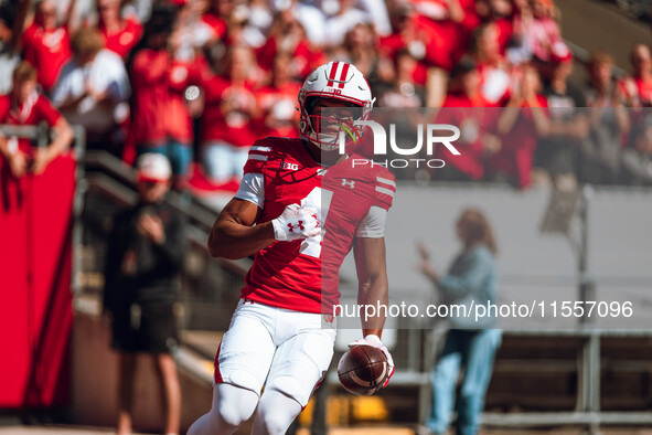 Wisconsin Badgers wide receiver C.J. Williams #4 celebrates a touchdown against the South Dakota Coyotes at Camp Randall Stadium in Madison,...