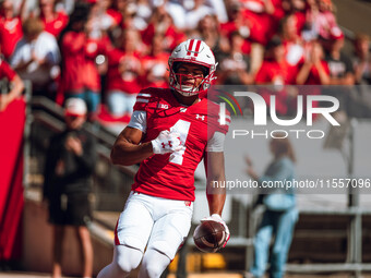 Wisconsin Badgers wide receiver C.J. Williams #4 celebrates a touchdown against the South Dakota Coyotes at Camp Randall Stadium in Madison,...