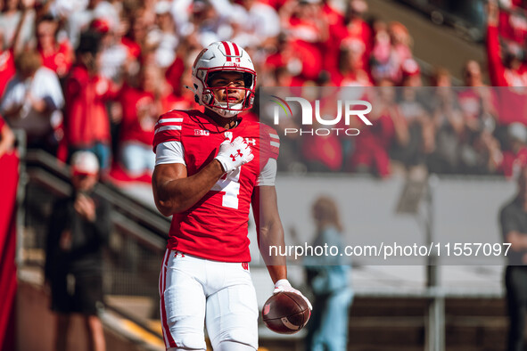 Wisconsin Badgers wide receiver C.J. Williams #4 celebrates a touchdown against the South Dakota Coyotes at Camp Randall Stadium in Madison,...