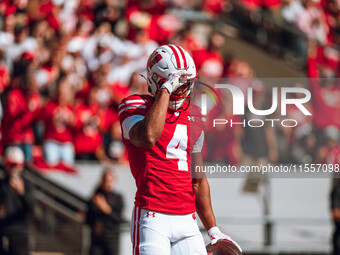 Wisconsin Badgers wide receiver C.J. Williams #4 celebrates a touchdown against the South Dakota Coyotes at Camp Randall Stadium in Madison,...