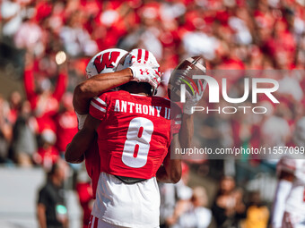 Wisconsin Badgers wide receiver C.J. Williams #4 celebrates a touchdown against the South Dakota Coyotes with Wisconsin Badgers wide receive...