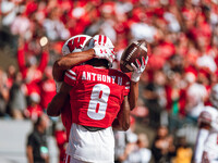 Wisconsin Badgers wide receiver C.J. Williams #4 celebrates a touchdown against the South Dakota Coyotes with Wisconsin Badgers wide receive...