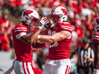 Wisconsin Badgers wide receiver C.J. Williams #4 celebrates a touchdown against the South Dakota Coyotes with Wisconsin Badgers tight end Tu...