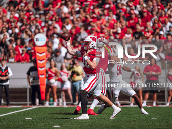 Wisconsin Badgers quarterback Tyler Van Dyke #10 attempts a pass against the South Dakota Coyotes at Camp Randall Stadium in Madison, Wiscon...