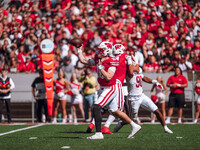 Wisconsin Badgers quarterback Tyler Van Dyke #10 attempts a pass against the South Dakota Coyotes at Camp Randall Stadium in Madison, Wiscon...