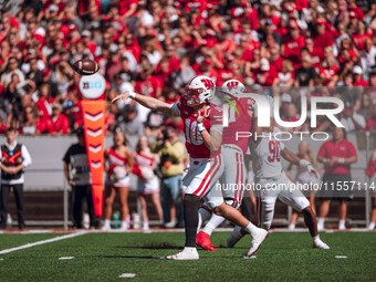 Wisconsin Badgers quarterback Tyler Van Dyke #10 attempts a pass against the South Dakota Coyotes at Camp Randall Stadium in Madison, Wiscon...