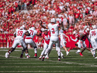 South Dakota quarterback Aidan Bouman #2 attempts a pass against the Wisconsin Badgers at Camp Randall Stadium in Madison, Wisconsin, on Sep...