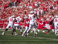 South Dakota quarterback Aidan Bouman #2 attempts a pass against the Wisconsin Badgers at Camp Randall Stadium in Madison, Wisconsin, on Sep...