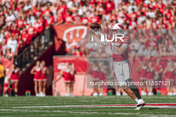 Wisconsin Badgers quarterback Tyler Van Dyke #10 attempts a pass against the South Dakota Coyotes at Camp Randall Stadium in Madison, Wiscon...