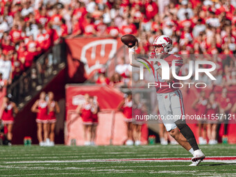 Wisconsin Badgers quarterback Tyler Van Dyke #10 attempts a pass against the South Dakota Coyotes at Camp Randall Stadium in Madison, Wiscon...