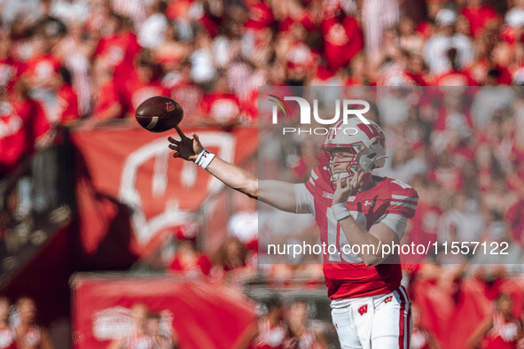 Wisconsin Badgers quarterback Tyler Van Dyke #10 attempts a pass against the South Dakota Coyotes at Camp Randall Stadium in Madison, Wiscon...