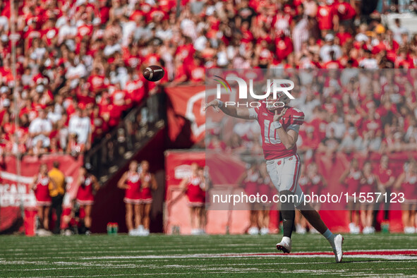 Wisconsin Badgers quarterback Tyler Van Dyke #10 attempts a pass against the South Dakota Coyotes at Camp Randall Stadium in Madison, Wiscon...