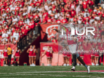 Wisconsin Badgers quarterback Tyler Van Dyke #10 attempts a pass against the South Dakota Coyotes at Camp Randall Stadium in Madison, Wiscon...