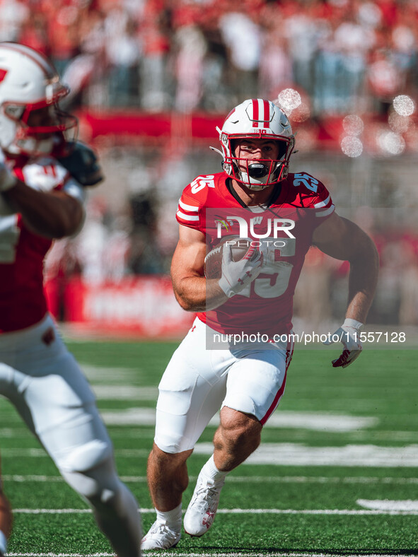 Wisconsin Badgers running back Cade Yacamelli #25 finds a hole against the South Dakota Coyotes at Camp Randall Stadium in Madison, Wisconsi...