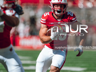 Wisconsin Badgers running back Cade Yacamelli #25 finds a hole against the South Dakota Coyotes at Camp Randall Stadium in Madison, Wisconsi...