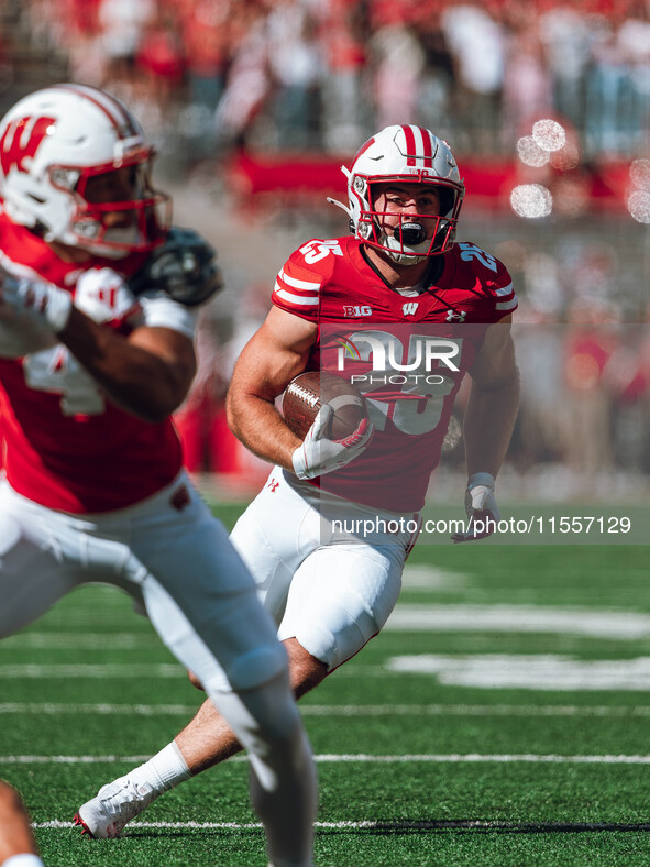 Wisconsin Badgers running back Cade Yacamelli #25 finds a hole against the South Dakota Coyotes at Camp Randall Stadium in Madison, Wisconsi...