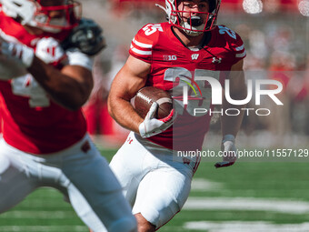 Wisconsin Badgers running back Cade Yacamelli #25 finds a hole against the South Dakota Coyotes at Camp Randall Stadium in Madison, Wisconsi...