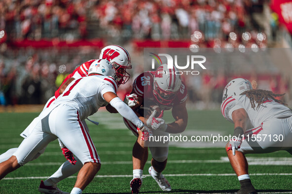 Wisconsin Badgers running back Cade Yacamelli #25 finds a hole against the South Dakota Coyotes at Camp Randall Stadium in Madison, Wisconsi...