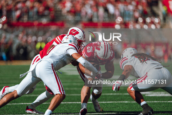 Wisconsin Badgers running back Cade Yacamelli #25 finds a hole against the South Dakota Coyotes at Camp Randall Stadium in Madison, Wisconsi...