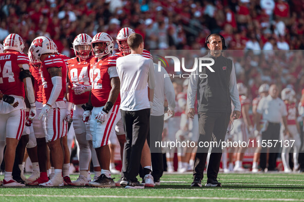 Wisconsin Badgers Head Coach Luke Fickell reviews a play on the board at Camp Randall Stadium in Madison, Wisconsin, on September 7, 2024. 