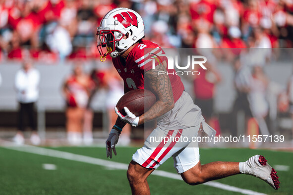 Wisconsin Badgers wide receiver Trech Kekahuna #2 returns a kickoff against the South Dakota Coyotes at Camp Randall Stadium in Madison, Wis...