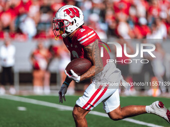 Wisconsin Badgers wide receiver Trech Kekahuna #2 returns a kickoff against the South Dakota Coyotes at Camp Randall Stadium in Madison, Wis...