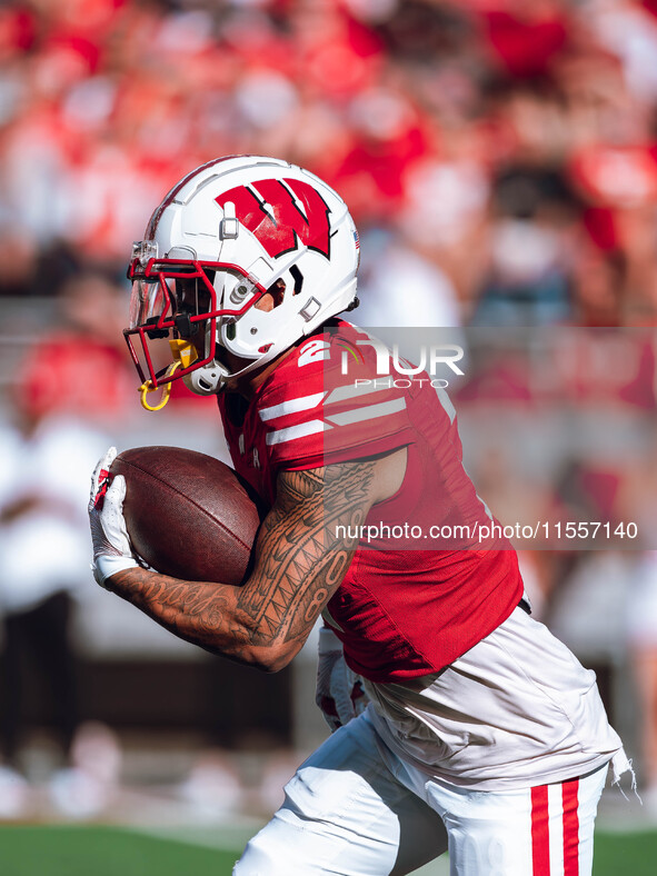 Wisconsin Badgers wide receiver Trech Kekahuna #2 returns a kickoff against the South Dakota Coyotes at Camp Randall Stadium in Madison, Wis...