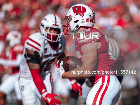 Wisconsin Badgers running back Cade Yacamelli #25 runs through the South Dakota Coyotes defense at Camp Randall Stadium in Madison, Wisconsi...