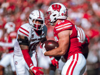 Wisconsin Badgers running back Cade Yacamelli #25 runs through the South Dakota Coyotes defense at Camp Randall Stadium in Madison, Wisconsi...