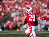 Wisconsin Badgers running back Cade Yacamelli #25 runs through the South Dakota Coyotes defense at Camp Randall Stadium in Madison, Wisconsi...