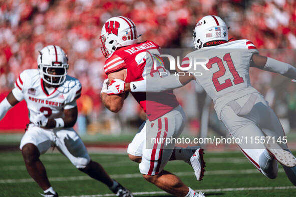 Wisconsin Badgers running back Cade Yacamelli #25 runs through the South Dakota Coyotes defense at Camp Randall Stadium in Madison, Wisconsi...