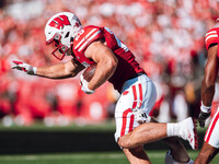 Wisconsin Badgers running back Cade Yacamelli #25 runs through the South Dakota Coyotes defense at Camp Randall Stadium in Madison, Wisconsi...