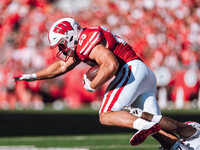 Wisconsin Badgers running back Cade Yacamelli #25 runs through the South Dakota Coyotes defense at Camp Randall Stadium in Madison, Wisconsi...